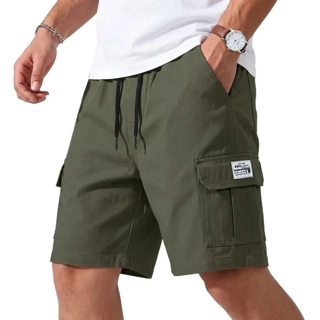 Man wearing green lightweight cargo shorts with side pocket detail