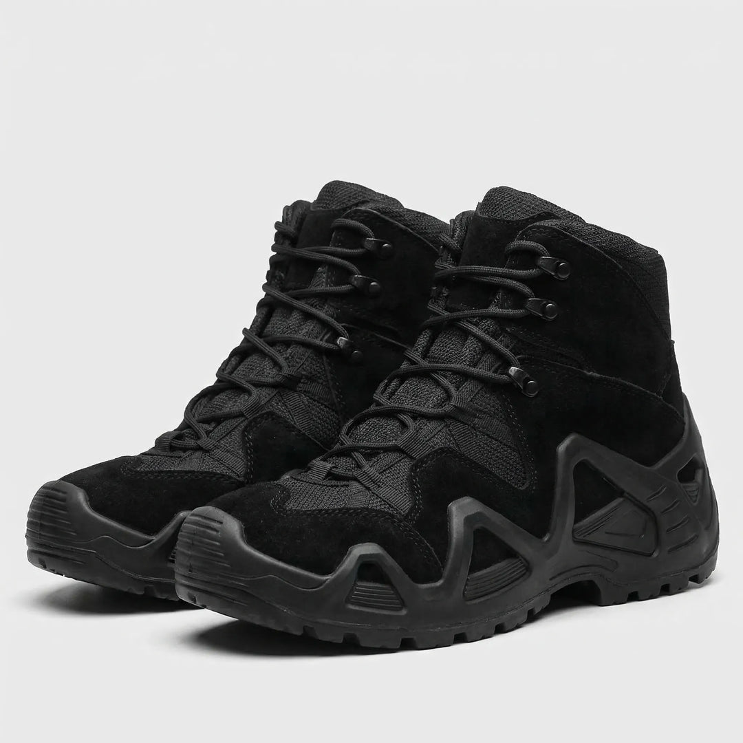 Studio view of men's black tactical outdoor boots showing lace-up design