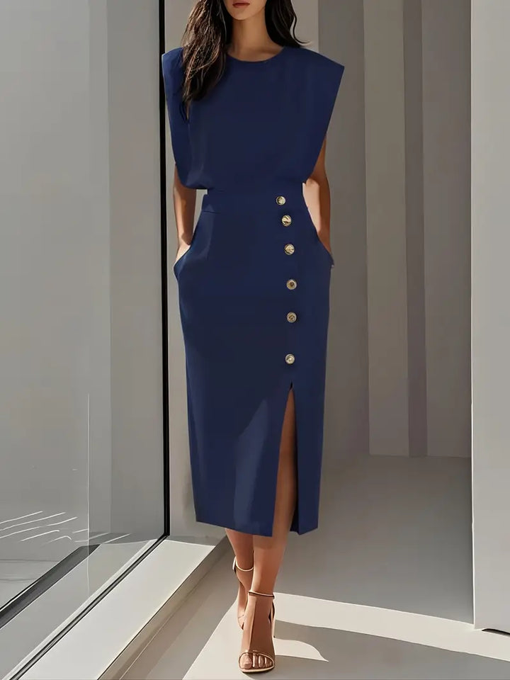 Woman wearing navy blue midi dress with side slit and button details