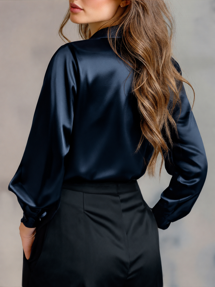 Classic womens clothing top featuring long sleeves and button down front