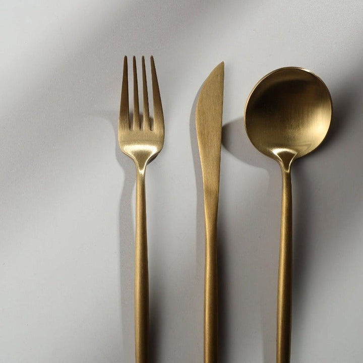 Balanced stainless steel dinner spoon showcasing ergonomic minimalist design