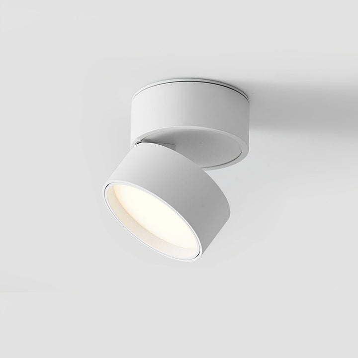 Adjustable ceiling spotlight casting soft ambient glow