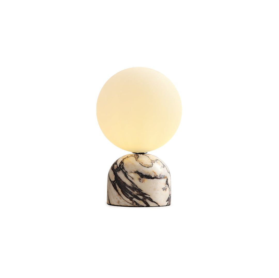 Modern bedside table lamp with spherical glass shade and marble base