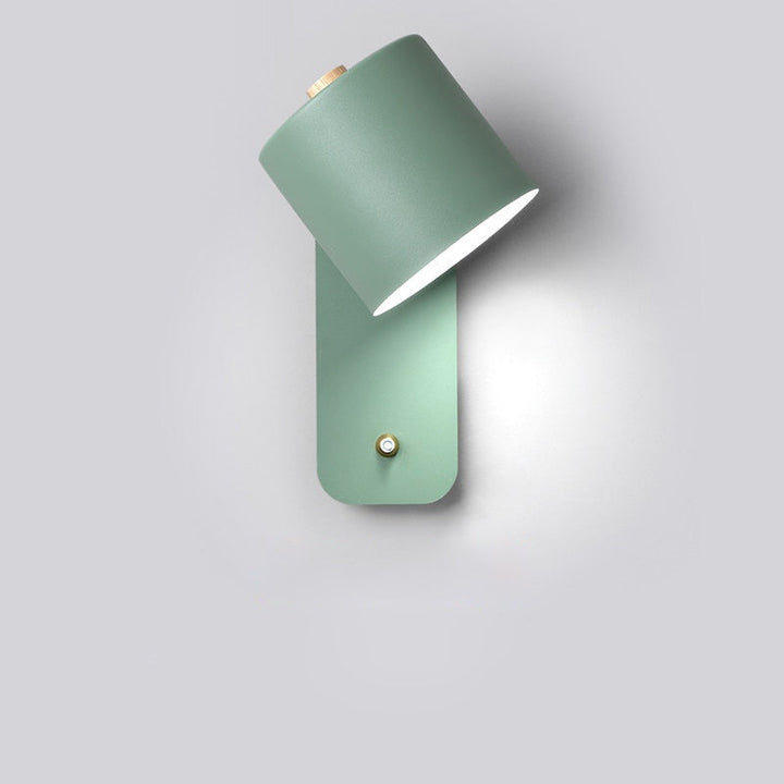 Green modern LED wall light showcasing its sleek metal design
