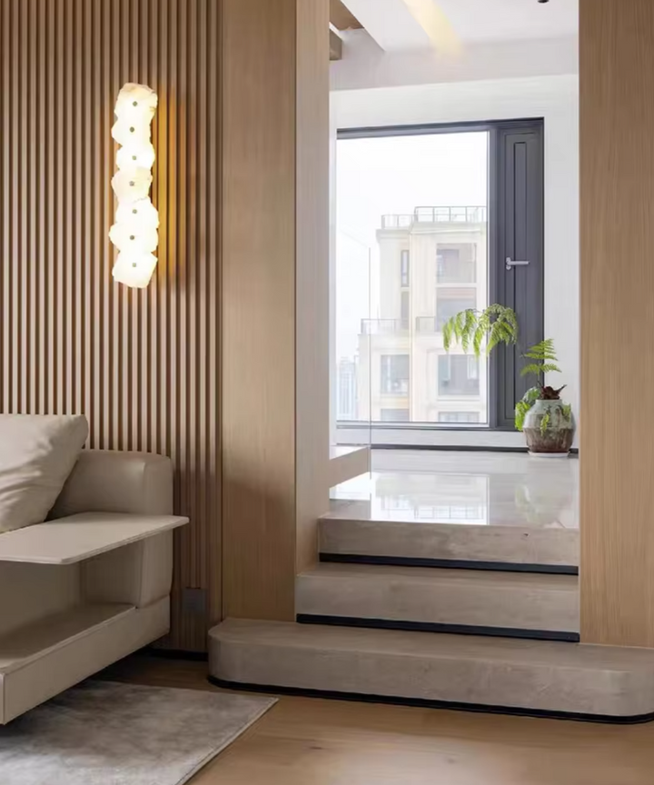 Close-up of the textured modern LED wall light showcasing organic alabaster grain