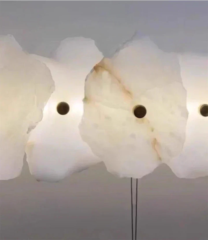 Sleek bedroom wall light with warm LED glow and natural alabaster construction