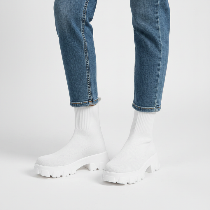 Pair of stylish women's modern platform sock boots displayed together on white background