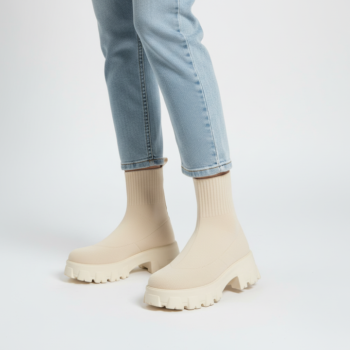 Close-up of textured sole and platform on trendy women's casual sock boots