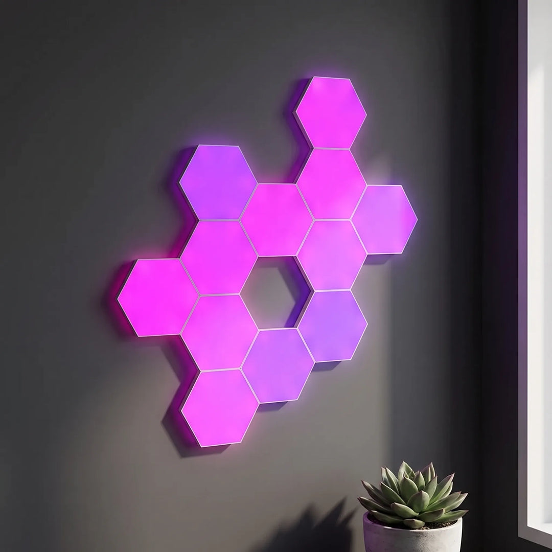 Modular hexagon wall lights mounted in a custom pink glowing pattern on a dark wall