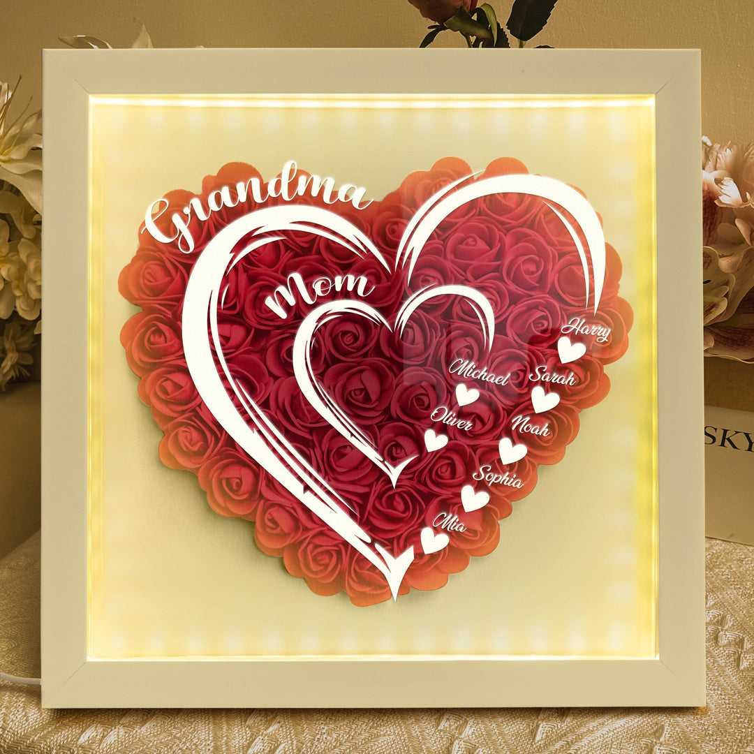 Illuminated heart shaped floral shadow box with family names for Mother's Day