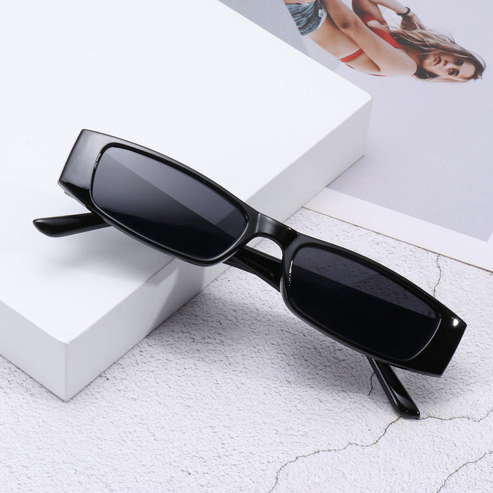 Stylish minimalist women's sunglasses with leopard print frames and UV protection