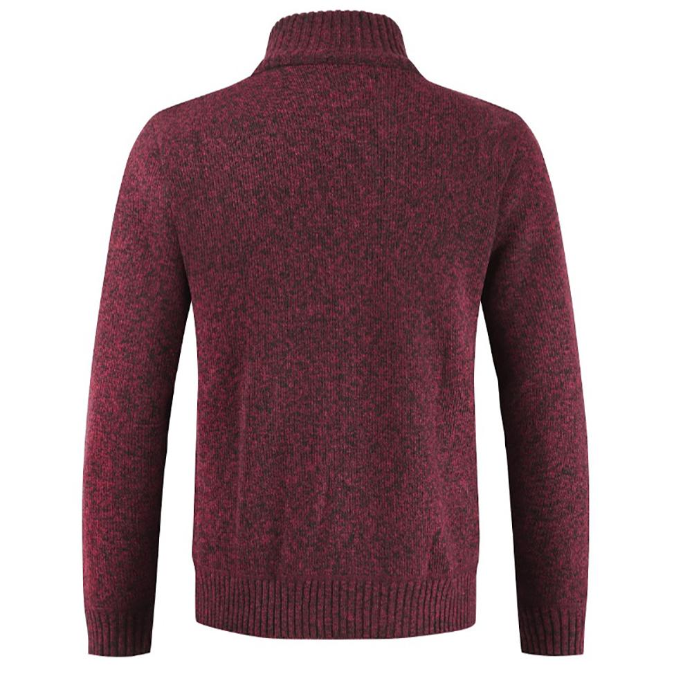 Sleeve cuff and pocket detail of mens cable knit zip-up sweater