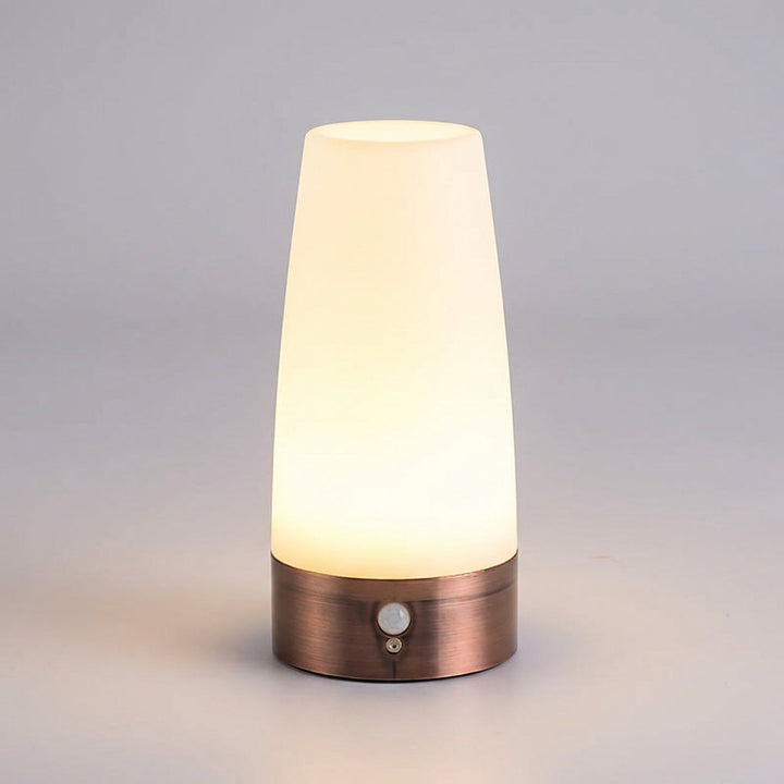 Standalone view of the motion sensor night light glowing with warm light
