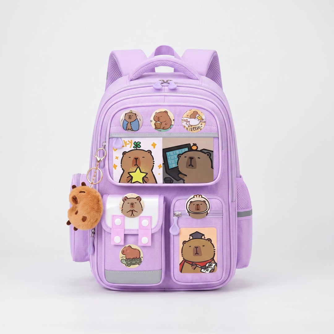 Flat lay of kids capybara backpack and matching accessories for school and travel