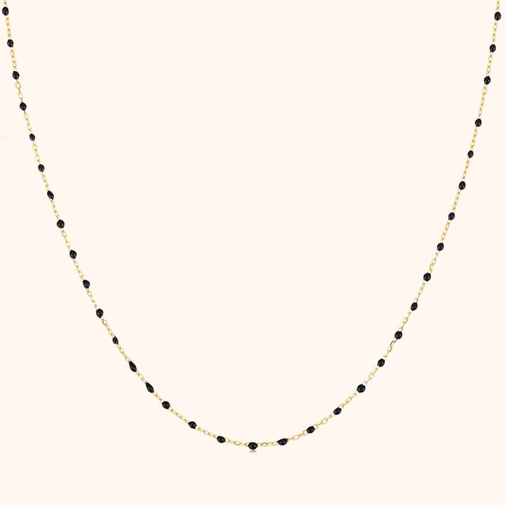 Women's black pearl statement necklace with gold plated chain and elegant layered design