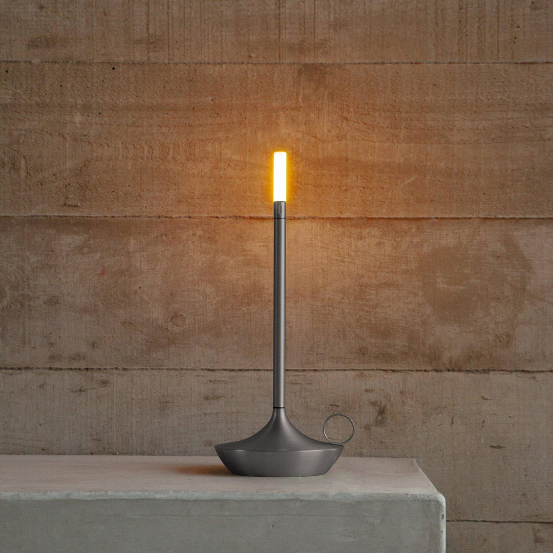 Portable decorative LED candle light casting a warm glow during dinner