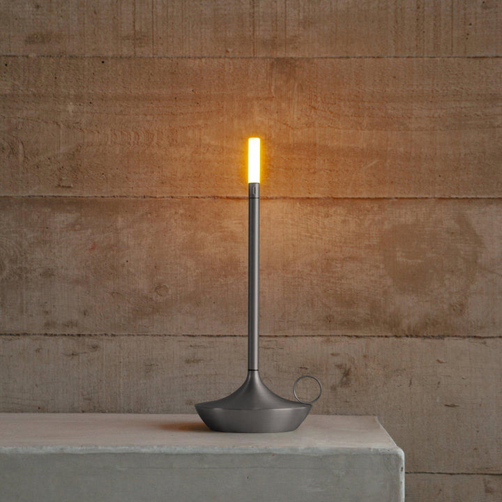 Portable decorative LED candle light casting a warm glow during dinner