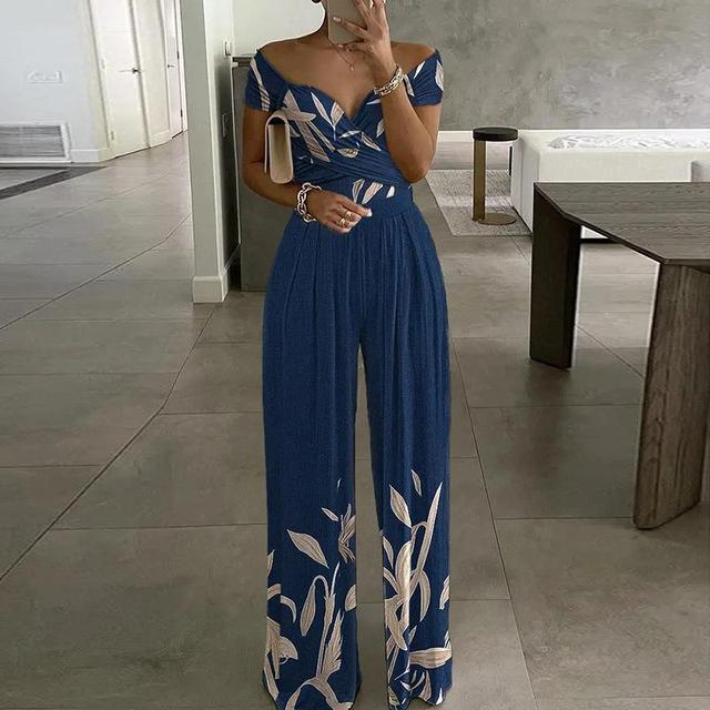Back view of women's floral casual wide-leg party jumpsuit outfit