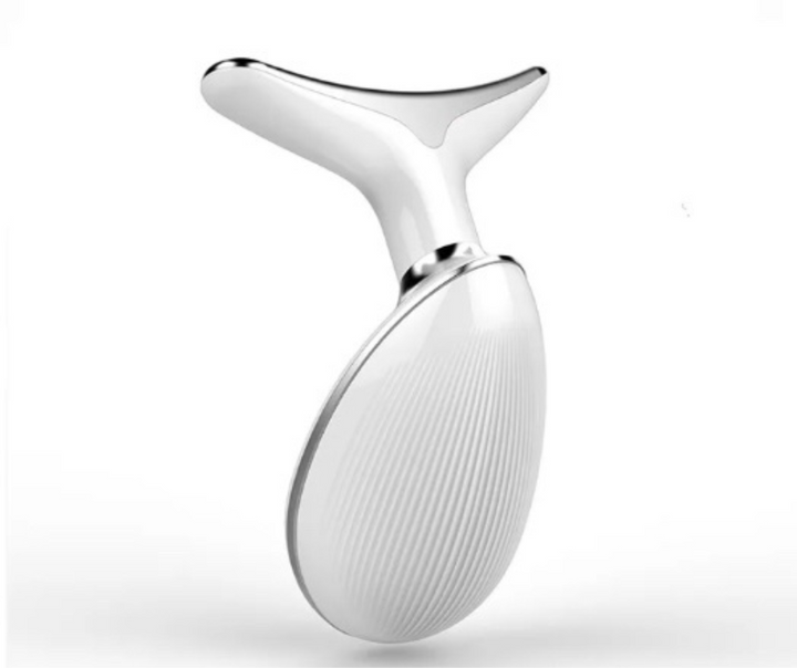 Side angle view of the ergonomic white facial firming device