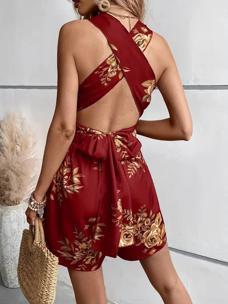 Side angle of womens floral halter neck romper