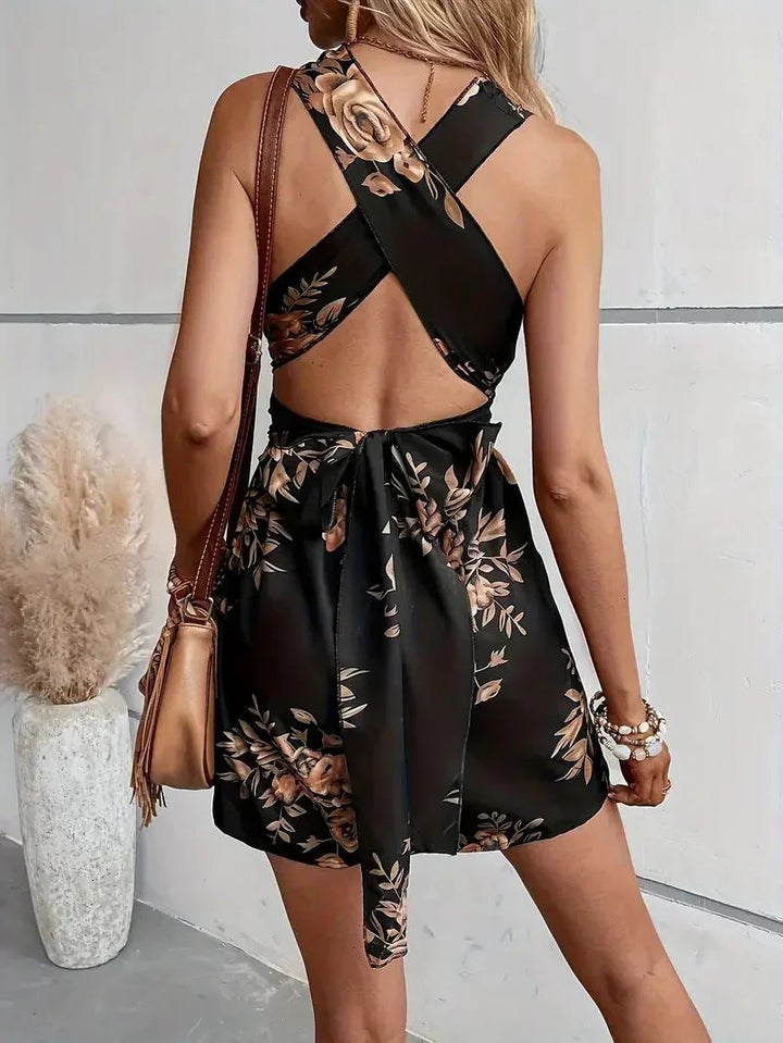 Full length view of floral halter neck short jumpsuit