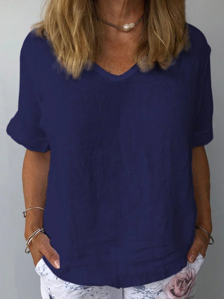 Woman wearing navy blue casual short sleeve top from front view