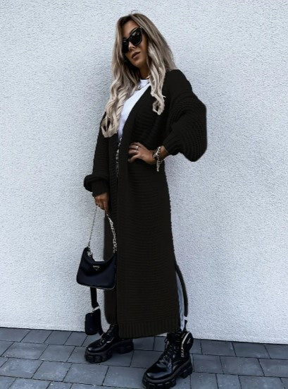 Womens winter fashion layering piece long knit cardigan, back view showing length