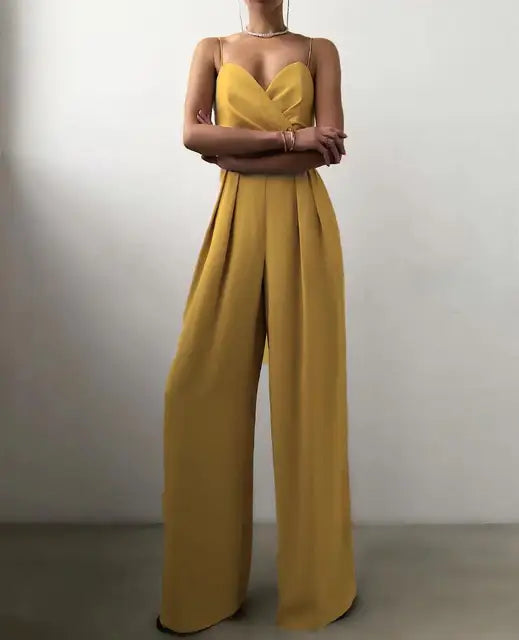 Model wearing a vibrant yellow elegant wide leg jumpsuit