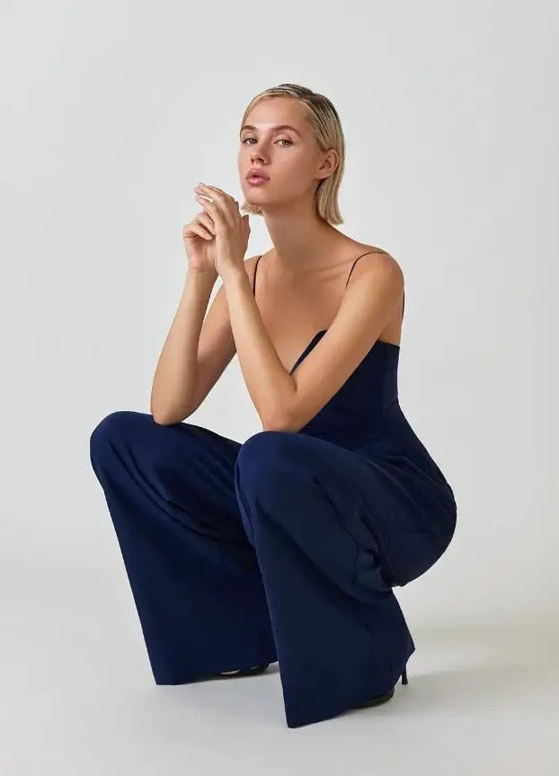 Flat lay of elegant women's jumpsuit and fashion accessories for party outfit