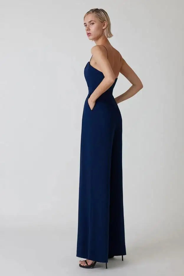 Full body shot of woman wearing chic wide leg jumpsuit for formal events
