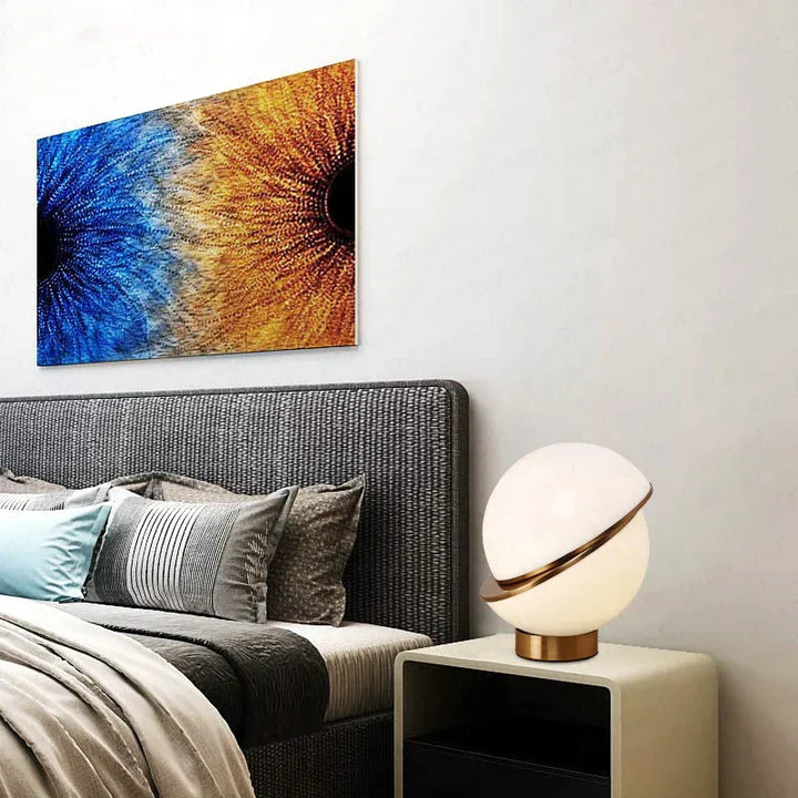 Modern table lamp illuminating a stylish bedroom interior setting