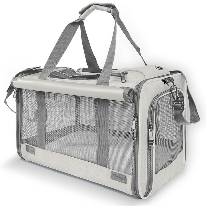 Light grey soft-sided pet carrier bag showcasing side mesh ventilation and top carrying handles against a white background
