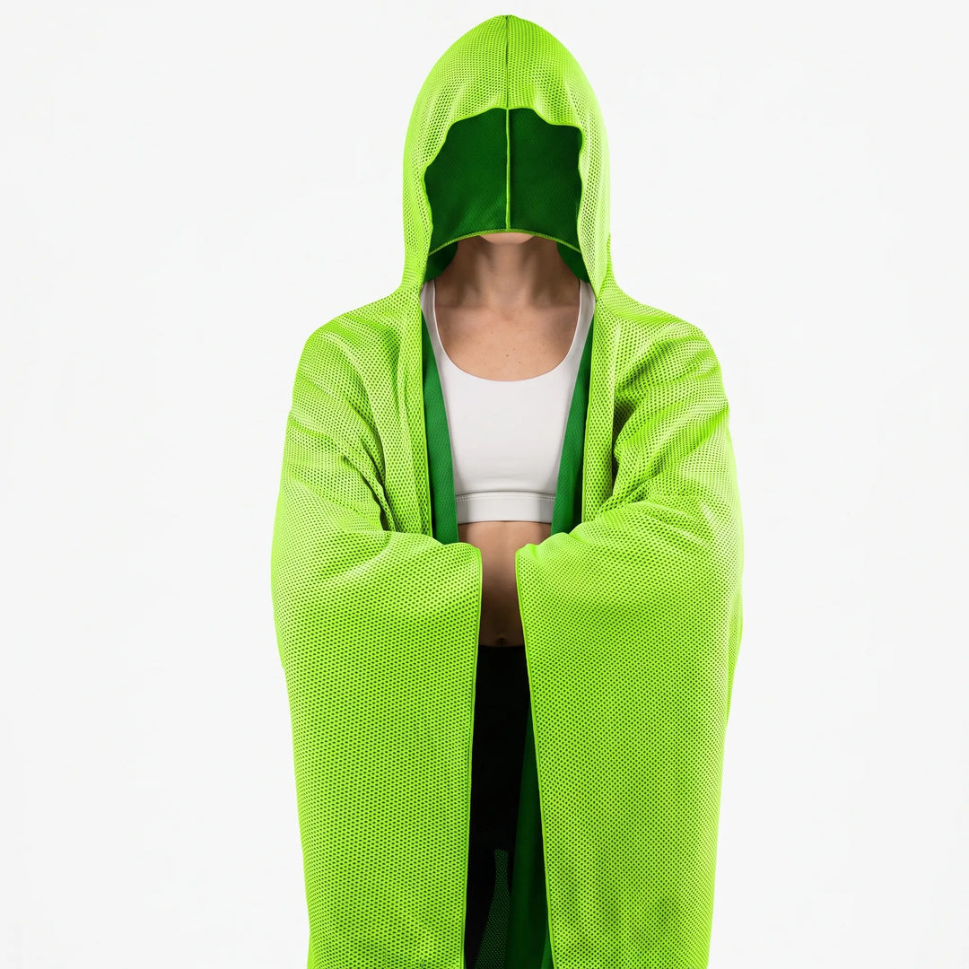 Front view of light green hooded cooling towel drape with snap closure