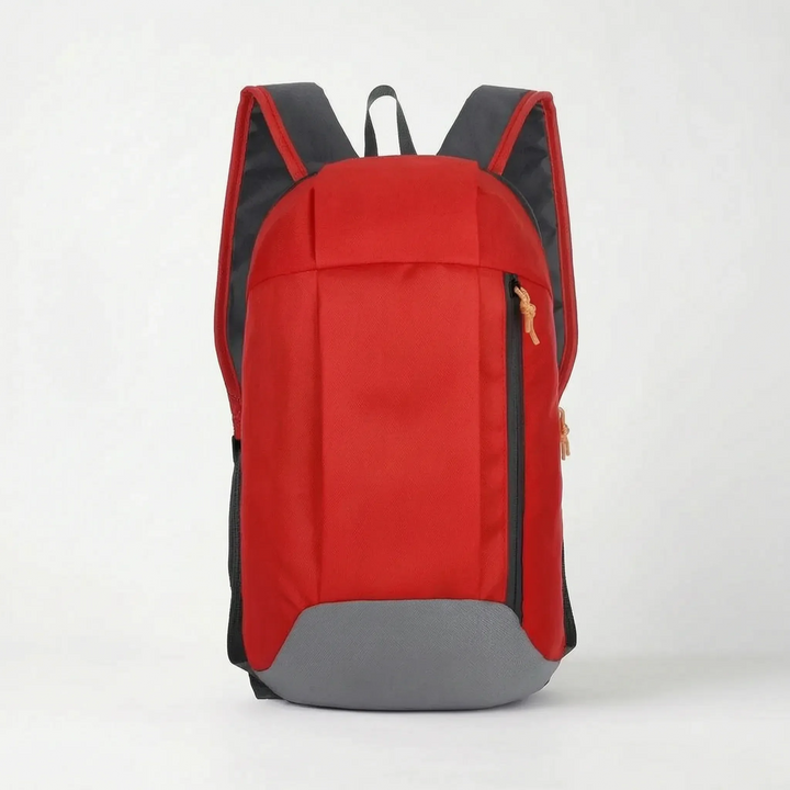 Studio shot of the red compact travel rucksack with grey bottom panel