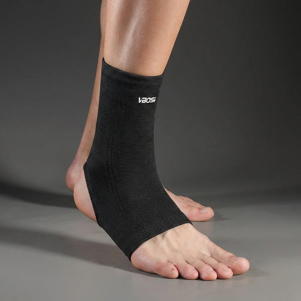 Unisex black ankle support sleeve showing compression fit for joint pain relief