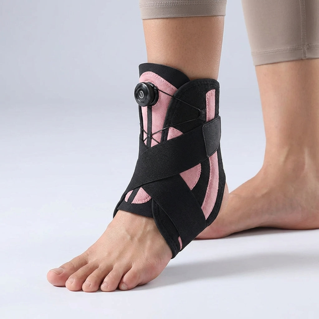 Close-up of the Black Pink adjustable ankle support brace worn on a foot
