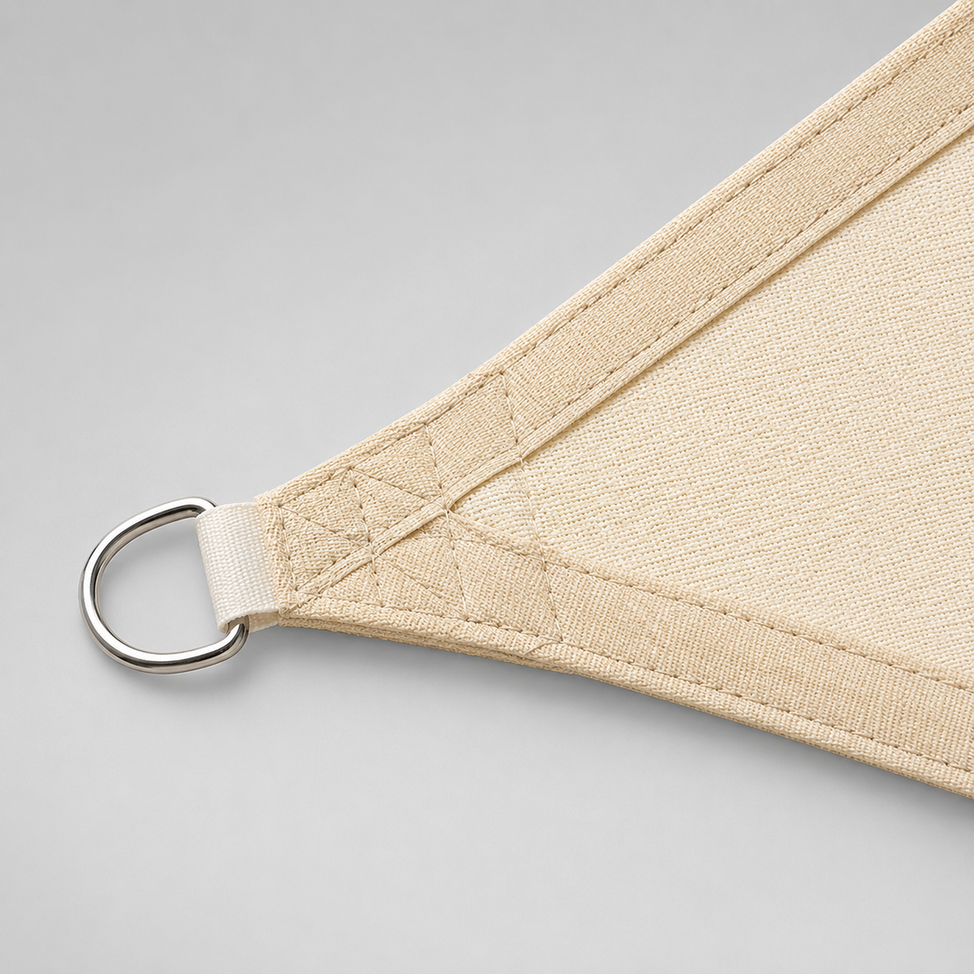 Sturdy corner rings and fabric detail of a triangular sun sail canopy
