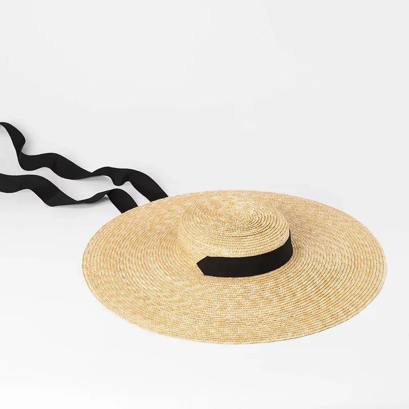 Complete view of a womens wide brim flat top summer hat