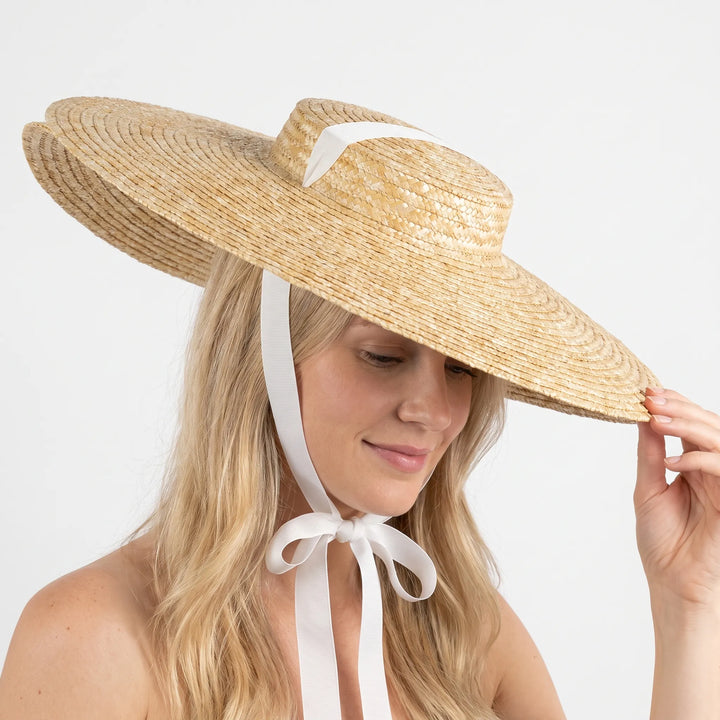 Stylish boater hat with a wide brim for summer beach days