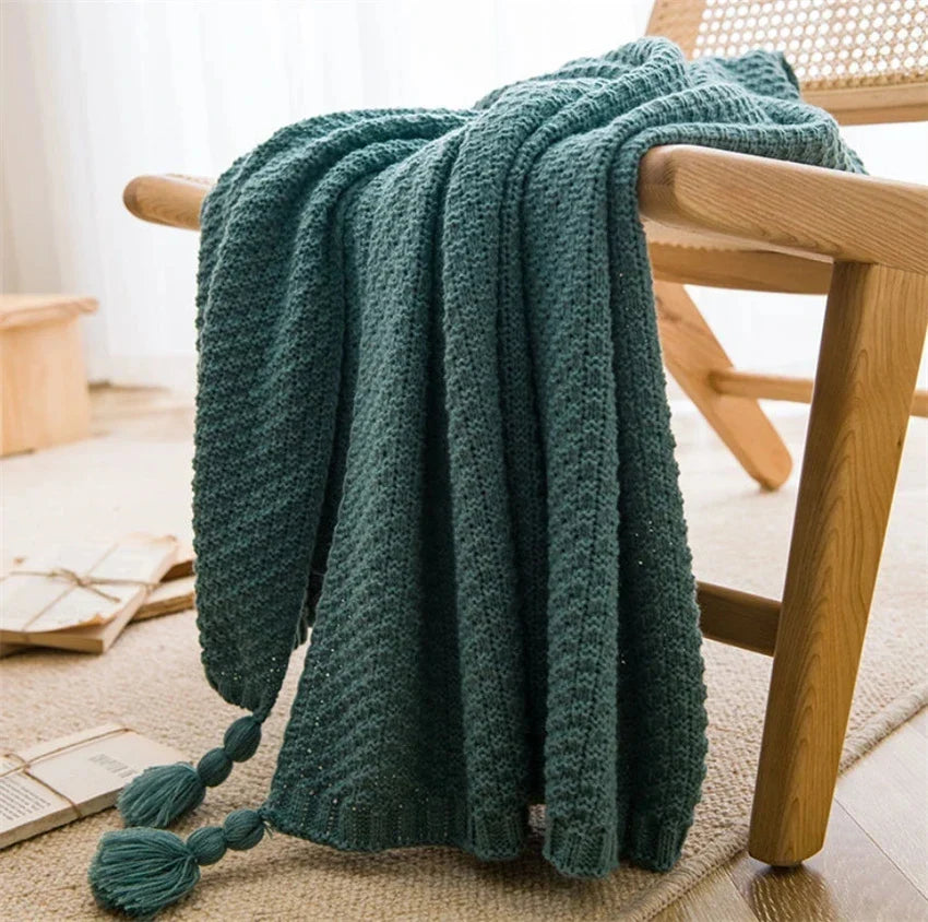 Versatile home decor accessory shown draped over a modern lounge chair