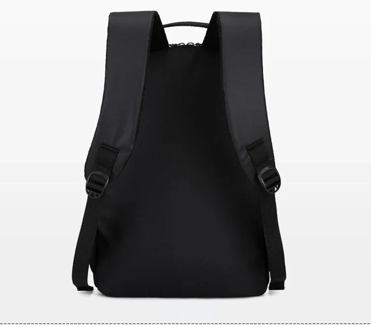 Business backpack resting on a desk setup showcasing sleek profile