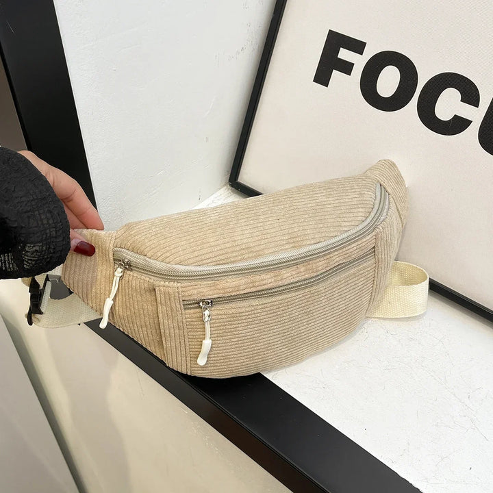 Casual lifestyle shot of woman styling the ribbed crossbody bag