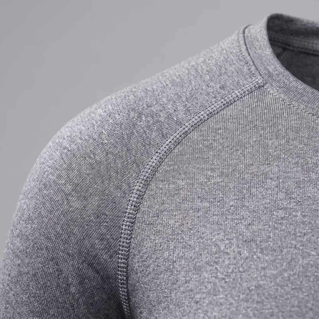 Close-up fabric detail of womens workout compression shirt athletic wear