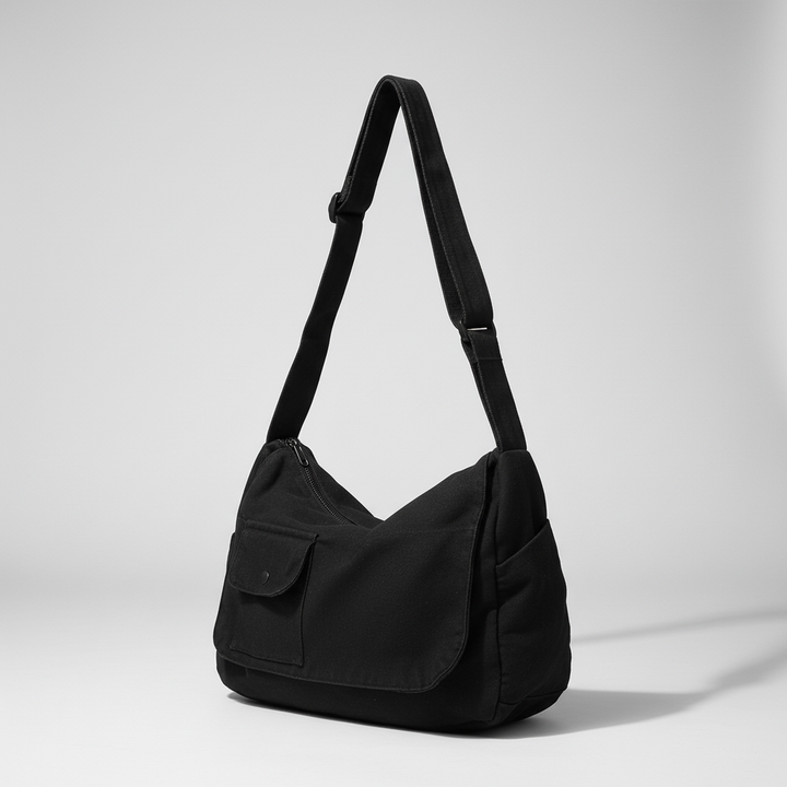 Model wearing the unisex messenger bag as a comfortable crossbody school bag.