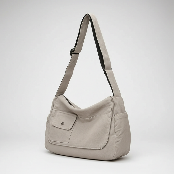 Casual lifestyle shot of the large work bag being carried by the shoulder strap.
