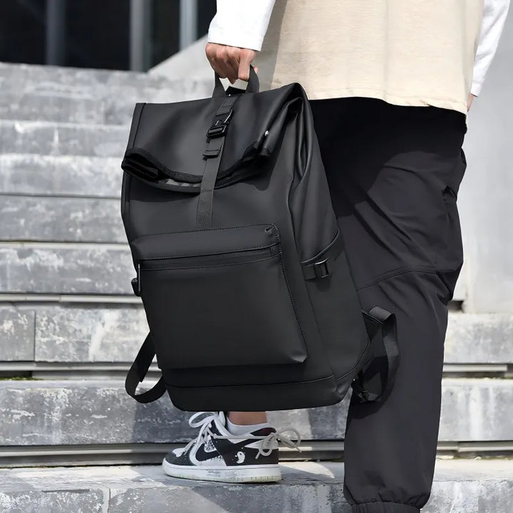 Unisex roll-top backpack displayed against a neutral studio backdrop