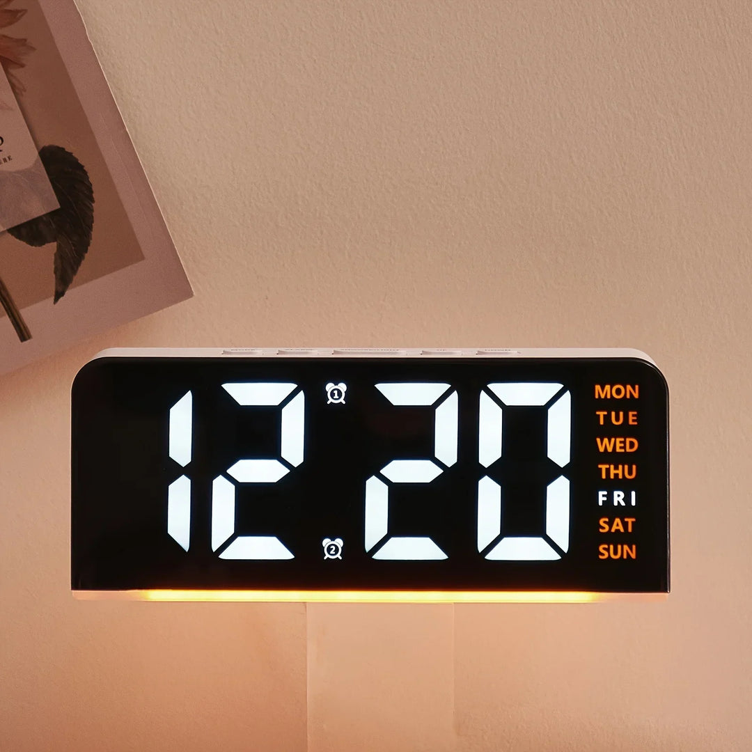 Back view of the electronic alarm clock showing power cable and speaker grille