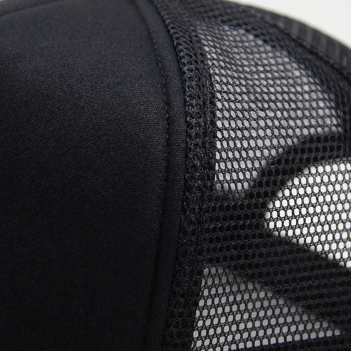 Flat lay of multiple unisex plain caps for casual wear