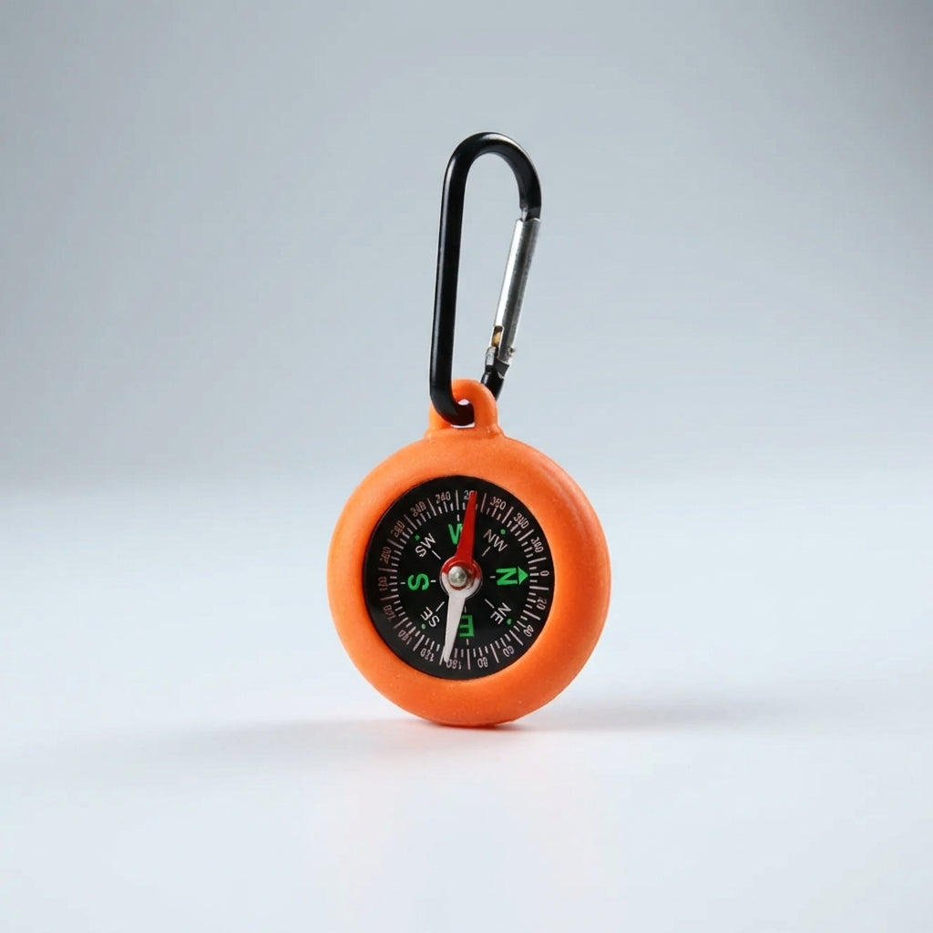 Backpacking accessory compass showing north direction for wilderness trails