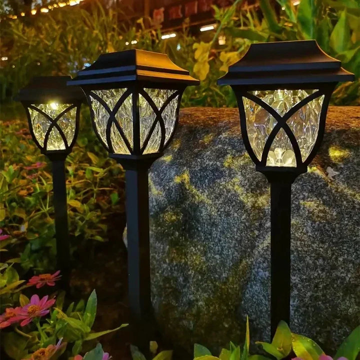 Waterproof outdoor lighting shining along residential sidewalk
